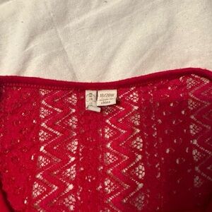 Red shirt with beautiful crochet detailing around chest, upper back & sleeves